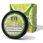 Bergamot and Cedar Solid Cologne in a black round tin, with a green lime-patterned label and matching box.