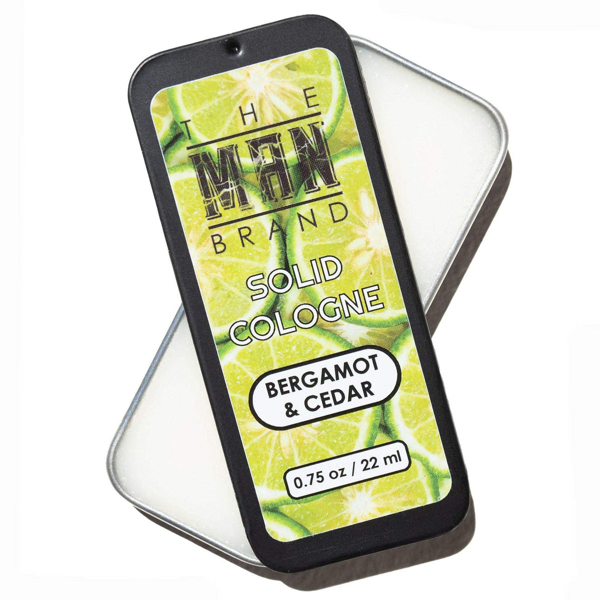 Bergamot and Cedar Solid Cologne in a slim black metal tin, with a bright green and yellow citrus-patterned label.