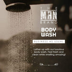 Business As Usual Body Wash in a dark bottle, with bold white branding and a showerhead graphic on the label.