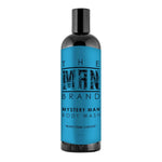 Mystery Man Body Wash in a black plastic bottle with a vivid blue label and bold black lettering.