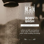 Mystery Man Body Wash, brown liquid cleanser marketed in a dark label design with white lettering and a fresh scent claim.
