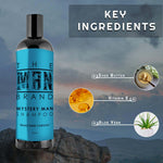 Mystery Man Shampoo in a black bottle with a bright blue label, bold lettering, and a black cap.