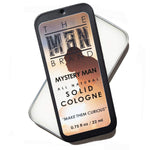 Mystery Man Solid Cologne in a black metal slide tin with a cream and copper printed label and bold lettering.