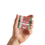 Sweet Tobacco Beard Balm in a small rectangular tin with a red, green and woodgrain label and bold white text.